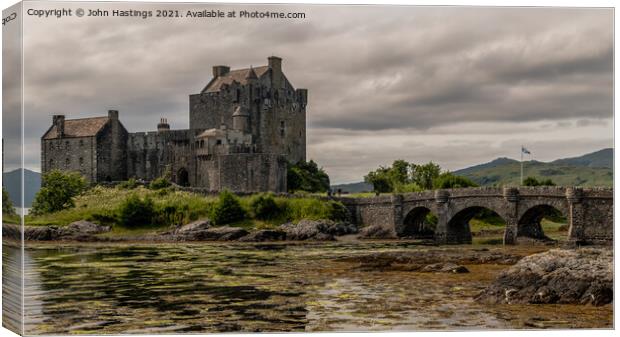 Scottish Fortress on the Highlands Canvas Print by John Hastings