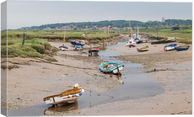 Boats moored at Blakeney Canvas Print by Jason Wells