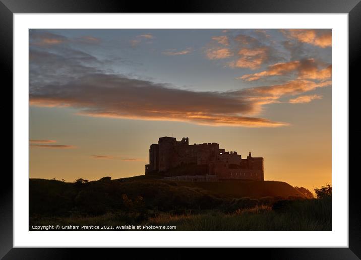 Bamburgh Castle  at Sunset Framed Mounted Print by Graham Prentice