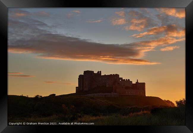 Bamburgh Castle  at Sunset Framed Print by Graham Prentice