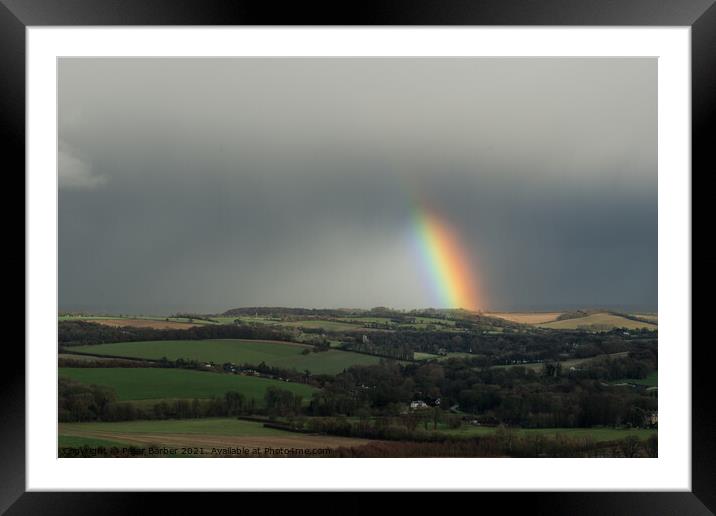 A rainbow over fields in the hampshire countryside Framed Mounted Print by Peter Barber