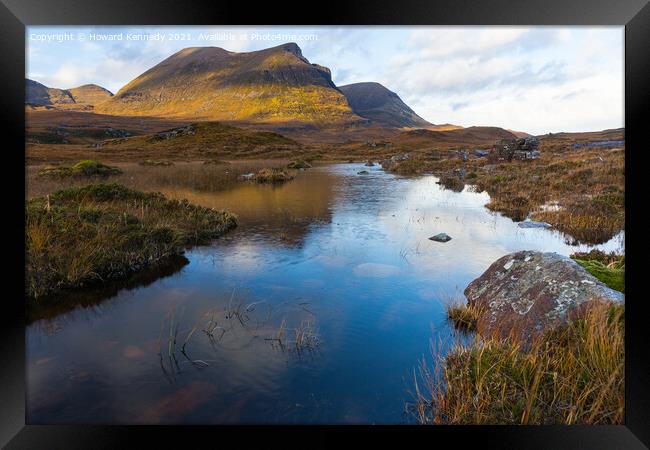 Quinag refelcted in a small lochan Framed Print by Howard Kennedy