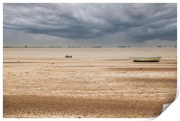 Norfolk coast with storm in the back over the sea boats moored on the sandy beach  Print by Holly Burgess