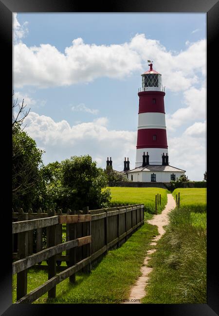 Happisburgh lighthouse at the end of the path Framed Print by Clive Wells