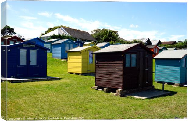 Bembridge beach huts on the isle of Wight. Canvas Print by john hill