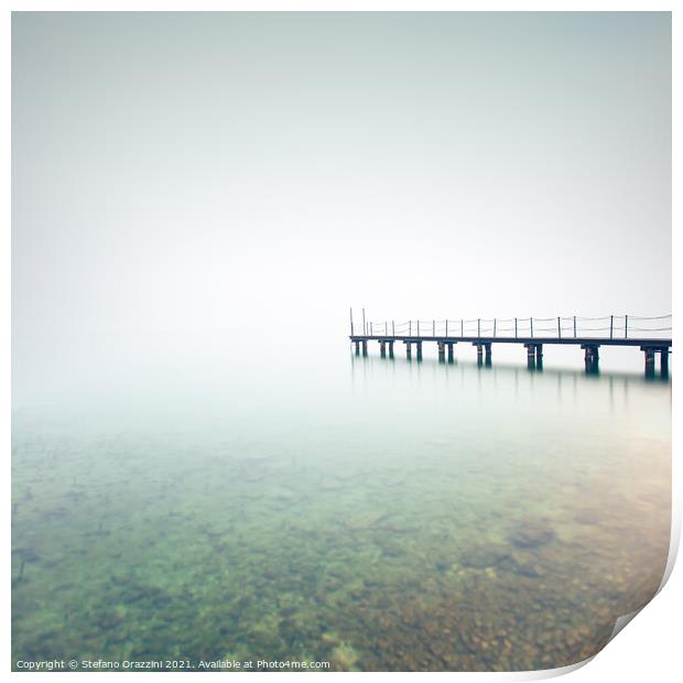 Pier in a foggy day. Lake Garda Print by Stefano Orazzini