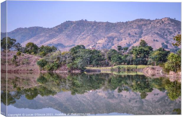 Reflection of trees and hills in the water Canvas Print by Lucas D'Souza