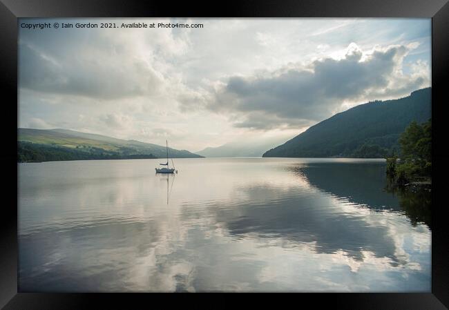 Solo Yacht on Loch Tay Perthshire Scotland  Framed Print by Iain Gordon