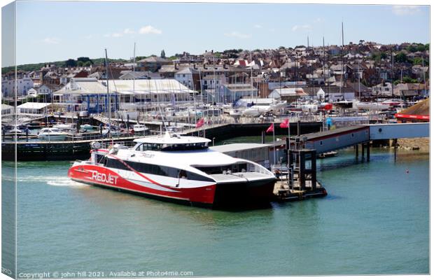 Red jet ferry at West Cowes on the Isle of Wight. Canvas Print by john hill