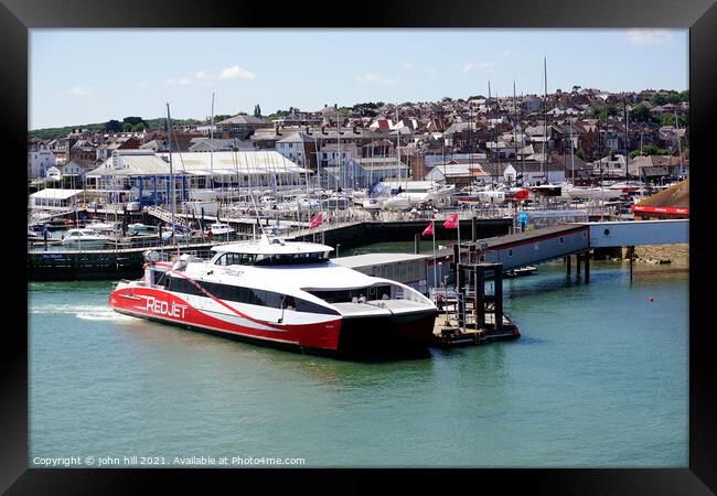 Red jet ferry at West Cowes on the Isle of Wight. Framed Print by john hill
