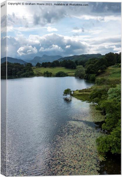 Loughrigg Tarn and the Langdale Pikes Canvas Print by Graham Moore