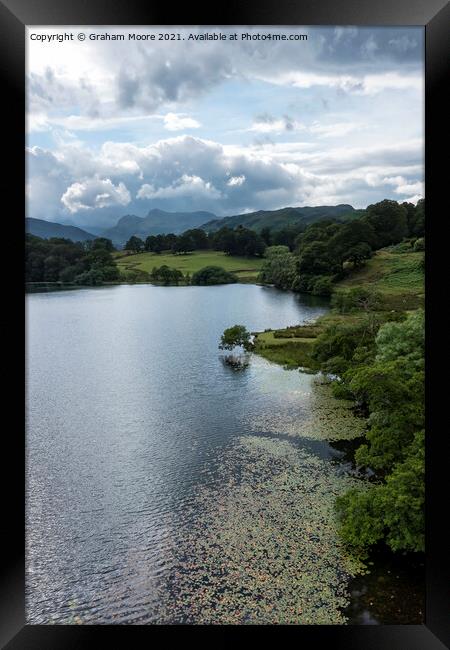 Loughrigg Tarn and the Langdale Pikes Framed Print by Graham Moore