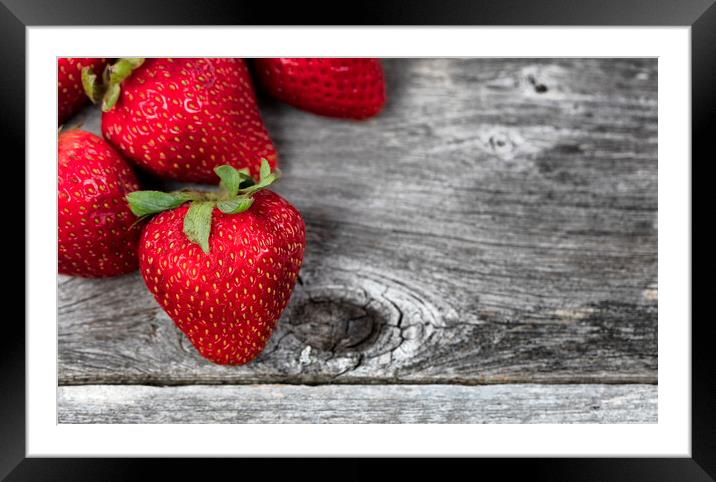 Close up of fresh strawberry fruit on rustic wood Framed Mounted Print by Thomas Baker