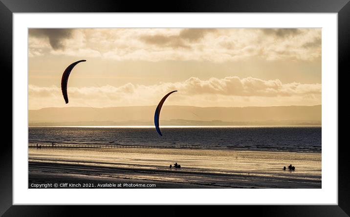 Kite Buggies on golden sands Framed Mounted Print by Cliff Kinch