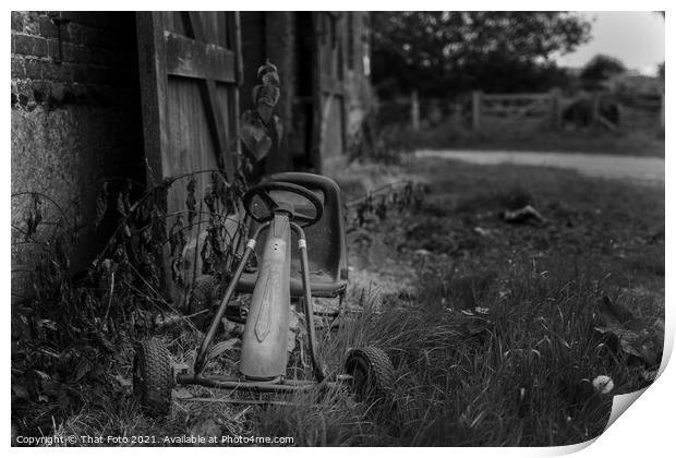 Old childs Gocart outside a deserted farm building Print by That Foto