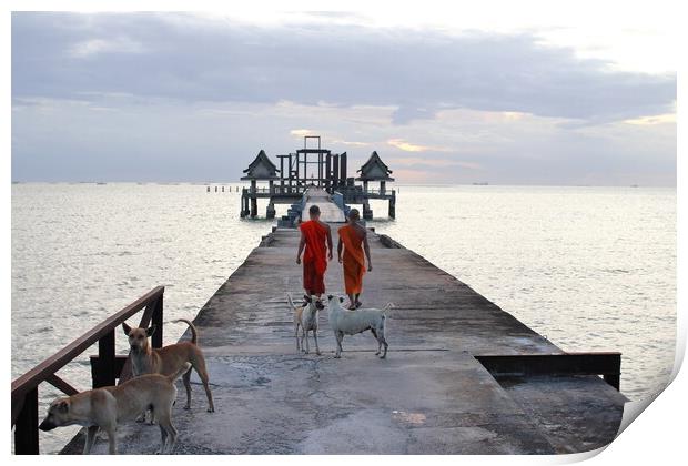Thai monks on the bridge or Pier , which leads to the never finished and abandoned Thai temple right on the Gulf in Thailand in the province of Chonburi Print by Wilfried Strang
