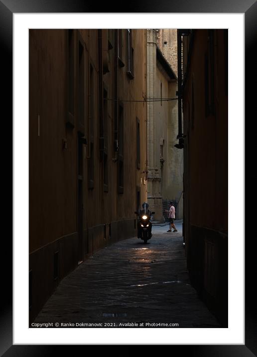 Bike in narrow street Framed Mounted Print by Ranko Dokmanovic