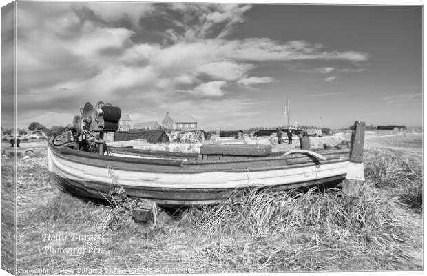 Holy island, boat in the sand on the beach in black and white  Canvas Print by Holly Burgess
