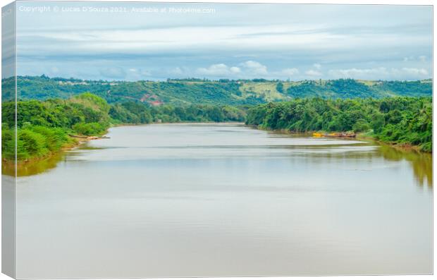 River with hills and clouds in the background Canvas Print by Lucas D'Souza