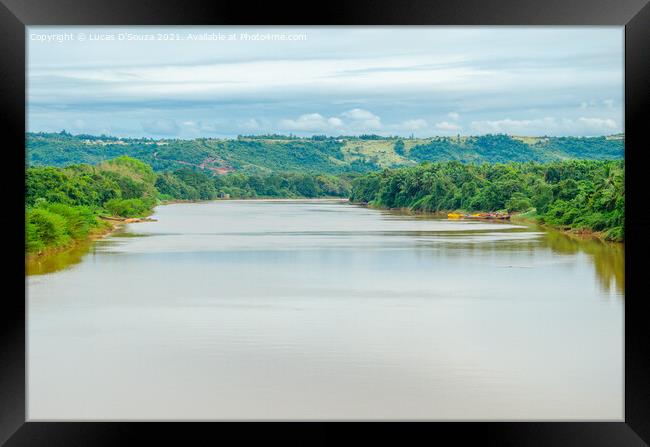River with hills and clouds in the background Framed Print by Lucas D'Souza