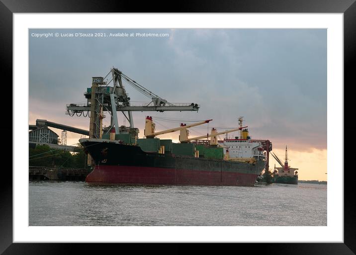 A ship at a harbor at sunset with heavy cranes in the background Framed Mounted Print by Lucas D'Souza