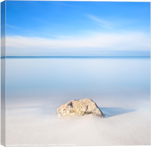 Rock on a white sandy beach Canvas Print by Stefano Orazzini