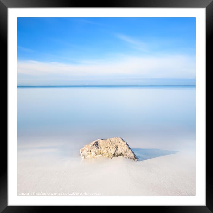 Rock on a white sandy beach Framed Mounted Print by Stefano Orazzini