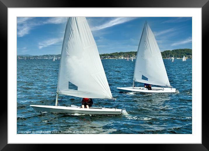 Teens racing in small sailboat with white sails. Framed Mounted Print by Geoff Childs