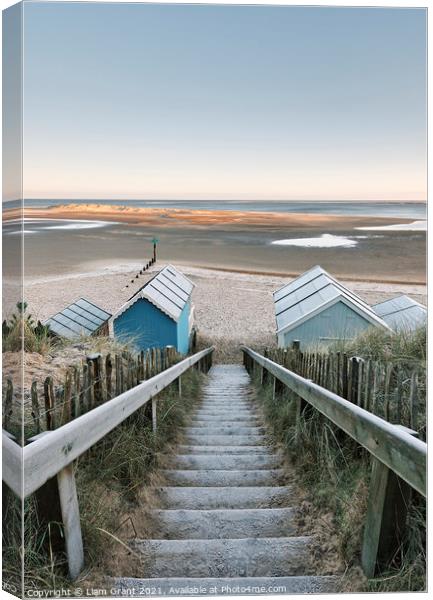 Frost covered beach huts at sunrise. Wells-next-the-sea, Norfolk, UK. Canvas Print by Liam Grant