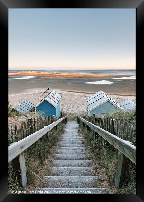 Frost covered beach huts at sunrise. Wells-next-the-sea, Norfolk, UK. Framed Print by Liam Grant