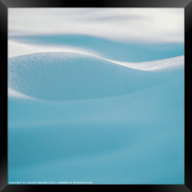 Snow curves in blue background Framed Print by Laurent Renault