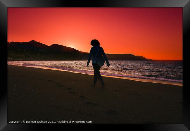 Sunrise Walker at Burrianna Playa Framed Print by Damian Jackson