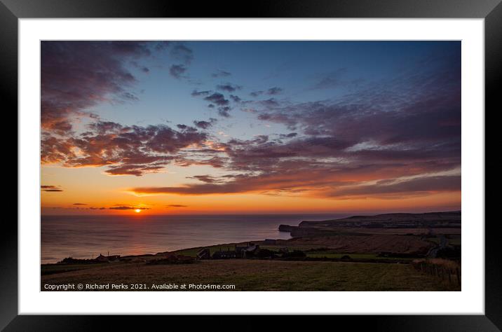 Sunrise in the clouds on Staithes Coast Framed Mounted Print by Richard Perks