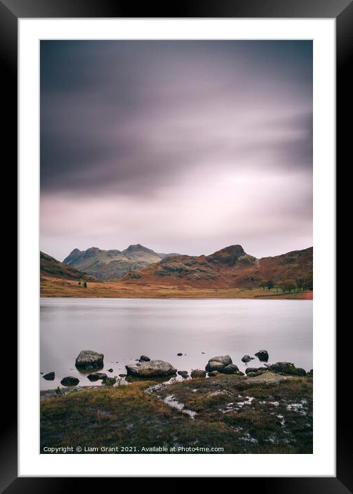 Clouds over Blea Tarn with Langdale Pikes beyond. Framed Mounted Print by Liam Grant