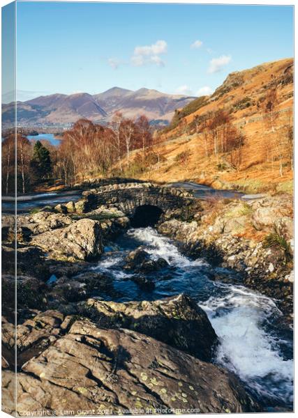 Ashness Bridge with Skiddaw beyond. Canvas Print by Liam Grant