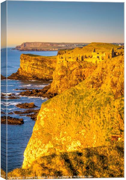 Majestic Dunluce Castle in the Golden Hour Canvas Print by David McFarland