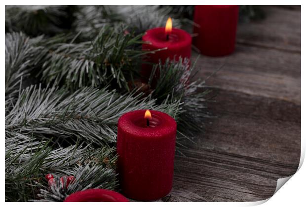 Red glowing candles with fir and wood dark background  Print by Thomas Baker