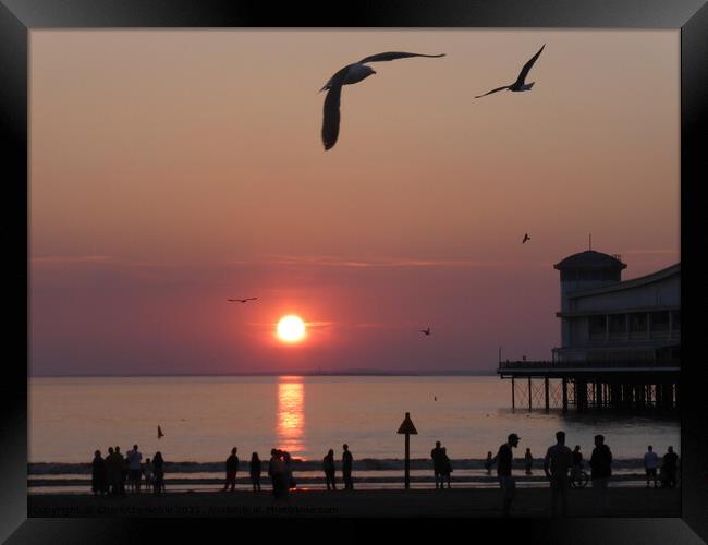 Sun setting over Weston Super Mare Framed Print by Charlotte Noble
