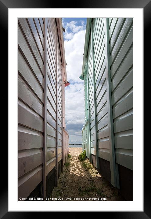 View Between the Beach Huts Framed Mounted Print by Nigel Bangert