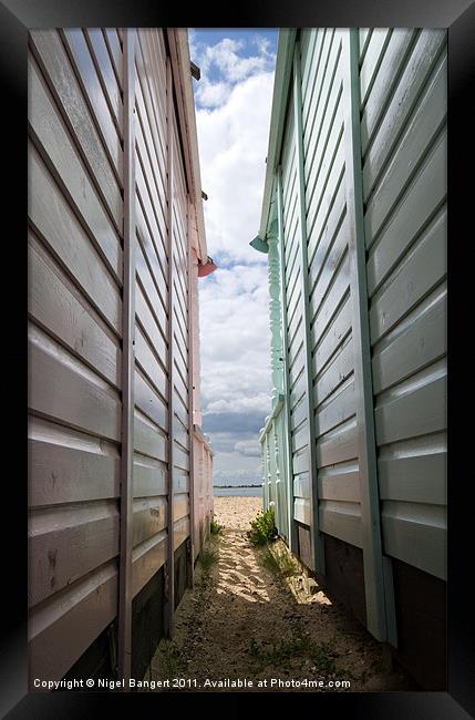 View Between the Beach Huts Framed Print by Nigel Bangert
