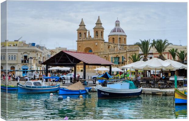 Marsaxlokk Harbour and town Canvas Print by Diana Mower