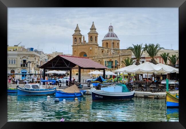 Marsaxlokk Harbour and town Framed Print by Diana Mower