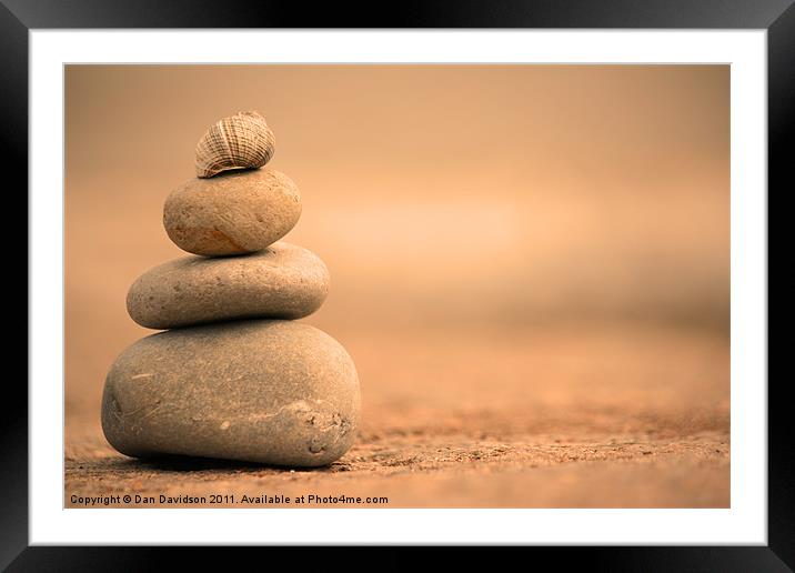 warm pebbles and shell balancing Framed Mounted Print by Dan Davidson