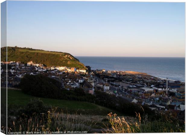 Hastings Seafront and Old Town as the Sun goes down. Canvas Print by Mark Ward