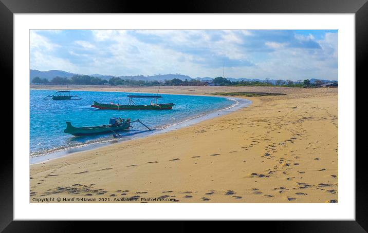 Longtail fishing boats at sand beach Framed Mounted Print by Hanif Setiawan