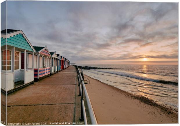 UK, Suffolk, Southwold, colourful beach huts and promenade at sunrise Canvas Print by Liam Grant