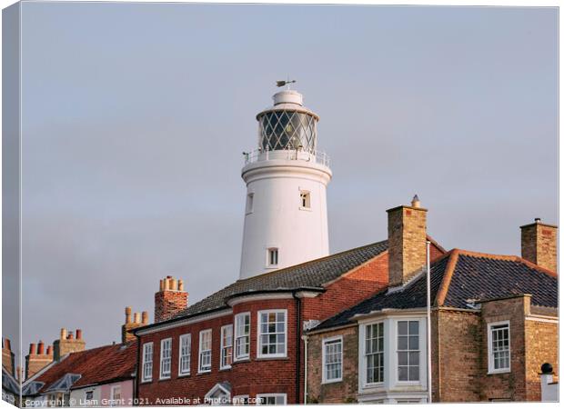 UK, Suffolk, Light from the sunrise on southwold lighthouse Canvas Print by Liam Grant