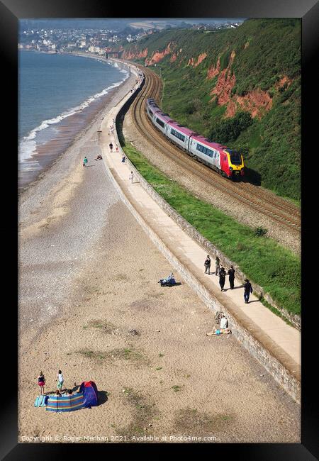 Express Train Racing along the Coastal Cliffs Framed Print by Roger Mechan