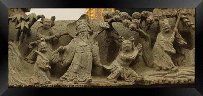 Buddhist bas-relief with sculptures of a family. Framed Print by Hanif Setiawan