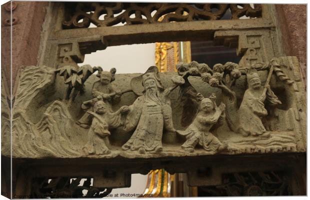 Buddhist bas-relief with sculptures of a family. Canvas Print by Hanif Setiawan